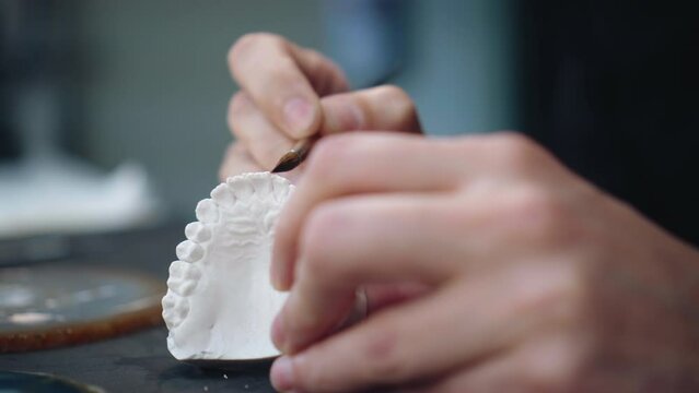 Dental Technician Making A Model Of Ceramic Veneers Medium Shot