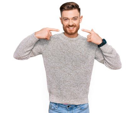 Young redhead man wearing casual winter sweater smiling cheerful showing and pointing with fingers teeth and mouth. dental health concept.