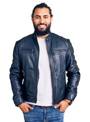 Fototapeta premium Young arab man wearing casual leather jacket with a happy and cool smile on face. lucky person.