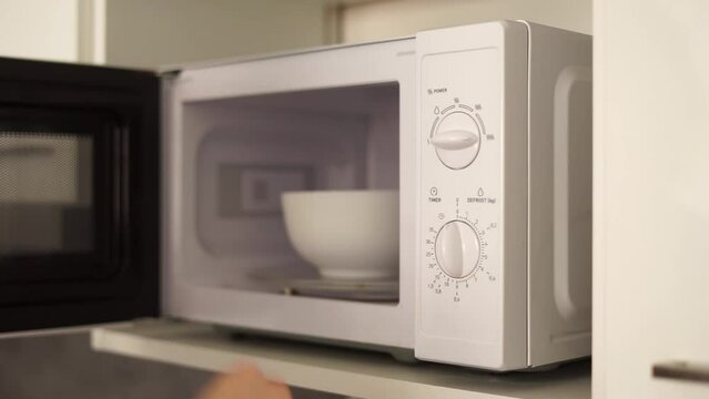 microwave heating food at home. High quality FullHD footage