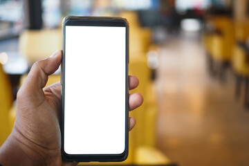 young man hand using smart phone with white screen at cafe 