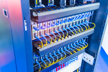 Fiber Optic cables connected to an optic ports and Network cables connected to ethernet ports.