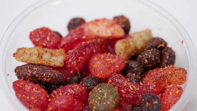 Assorted chilli chamoy candy on a lazy susan