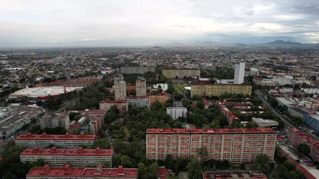 side drone shot of Tlatelolco urban centre in mexico city during storm
