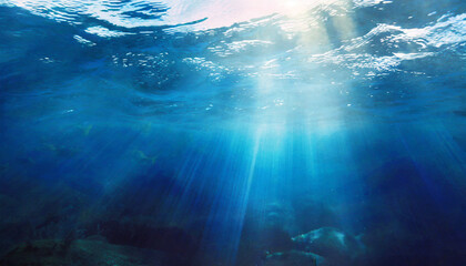 Fototapeta na wymiar Vivid abstract underwater scene: sunlight piercing through ocean depths, creating a mesmerizing, defocused backdrop