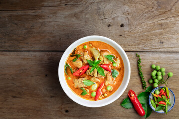 Chicken green curry Asian food, Beef green curry Thai food on a soup bowl with a mixture of herbs, vegetables and Thai red chilli spices. Top view.