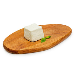 Goat cheese, on a wooden board, on a white background, isolate