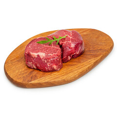 Fresh beef meat, minion steak, on a wooden board, on a white background, isolate