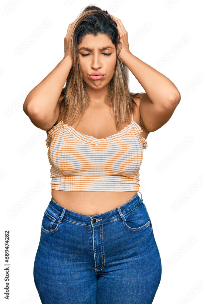 Poster beautiful brunette woman wearing casual clothes suffering from headache desperate and stressed becau