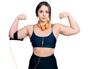 Young hispanic girl wearing sportswear doing strong gesture skeptic and nervous, frowning upset because of problem. negative person.