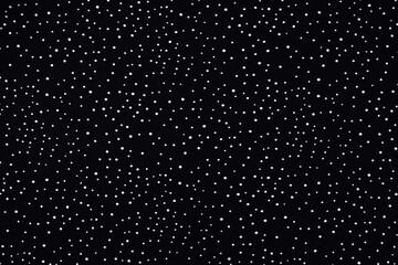 Black cloth with white polka dots. Fabric background.