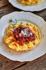 Curd waffles with strawberry sauce. Waffles with strawberry sauce. Top view.