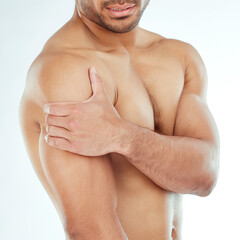 Shoulder pain, hands and fitness man in studio with muscle problem, arthritis or fibromyalgia on...