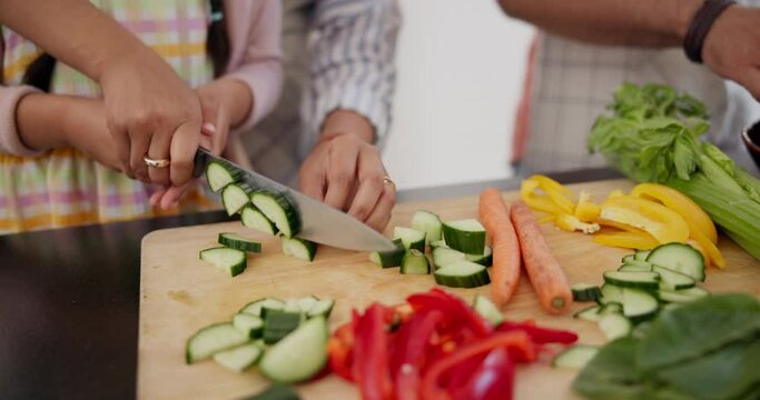 Cooking, vegetables and hands of kid or mother on cutting board in kitchen together closeup. Helping, child and learning from mom with cucumber, nutrition or healthy food in home for dinner or salad
