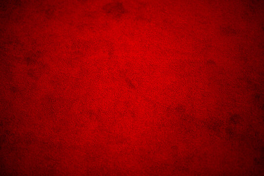 blurred image of red carpet floor, red carpet fabric texture and background seamless