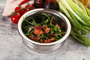 Salad with salmon and arugula