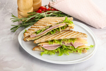 Homemade club sandwich with ham and cheese