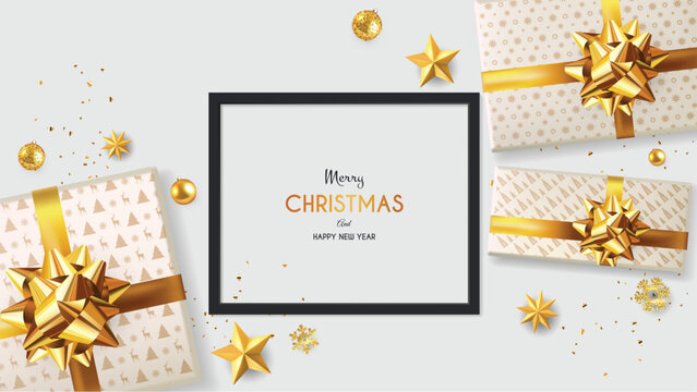 Top view Christmas Golden Decoration on gray Table. Golden balls, stars, and gift box with golden ribbon.