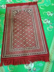 Colorful islamic  praying mat or  carpet with a pattern in the style of Khiva. photo taken in malaysia