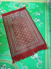Colorful islamic  praying mat or  carpet with a pattern in the style of Khiva. photo taken in malaysia
