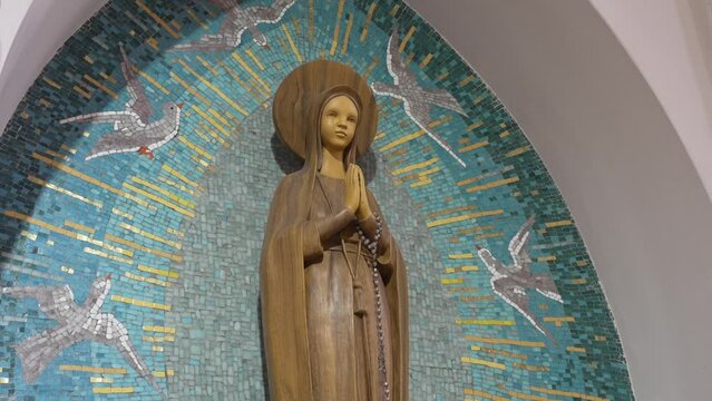 Statue of Mary with Mosaic Backdrop