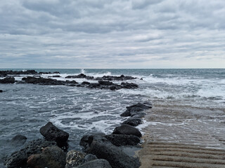 
This is the Jeju Island beach with rough waves.