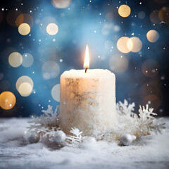White Christmas candle with snow and bokeh lights