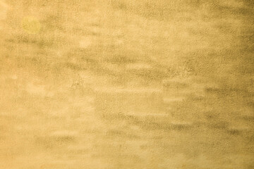 facade brown old wall background rough grain grungy plaster texture surface beige ancient design on...
