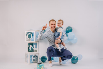 Infant Father and son at a one-year anniversary dance in the studio