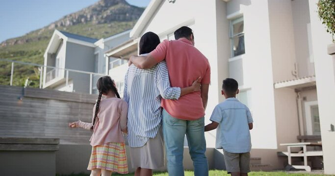 Family, back and hug outdoor at new home for success, achievement or pride in real estate investing. Parents, kids and love at house, property or fresh start on lawn, backyard or garden in Cape Town