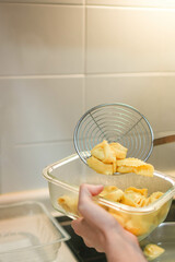 Vertical view of ravioli pasta being cooked in house kitchen for lunch