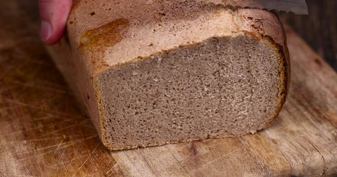 black rye loaf of rectangular bread, fresh bread using a mixture of wheat and rye flour
