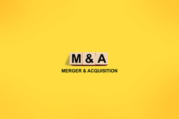 M&A merger and acquisition, word text written on wooden block, business term