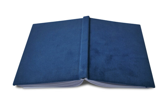 Opened old book facing down on floor, cut out isolated