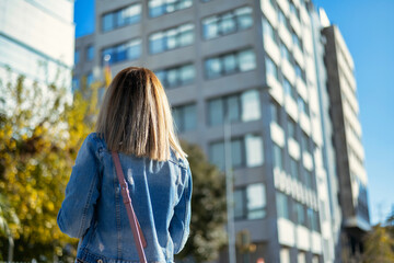 Back View Of A Young Woman In The City