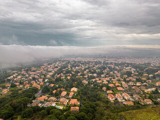 Nicolosi, Italy - Elevated View of Residential Area under a Dramatic Cloudscape