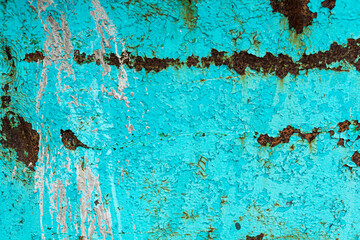 Turquoise paint on rusty metal
