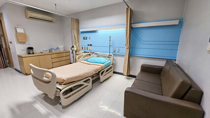 Hospital bed. Patient Bed. Empty hospital bed in hospital recovering room. Patient room. Electronically adjustable bed and facilities in an inpatient room. Hospital Ward
