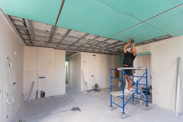 Two man help for ceiling house construction