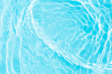 Obraz premium Bluewater bubbles on the surface ripples. Defocus blurred transparent white-black colored clear calm water surface texture with splash and bubbles. Water waves with shining pattern texture background.