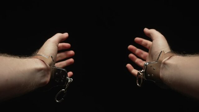 Man breaking free from handcuffs