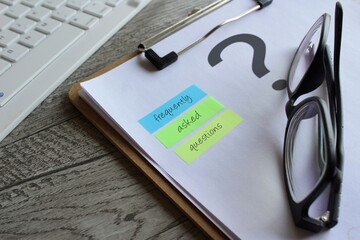 Close image of paper clipboard with question mark and text FREQUENTLY ASKED QUESTIONS.
