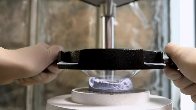 Mouth guard for teeth, printed on a 3D printer in dental clinic laboratory. 4k cinematic slow motion video