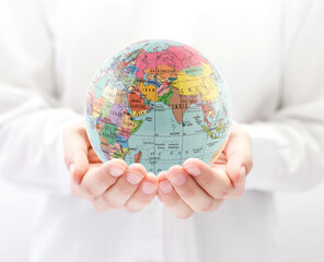 Planet Earth political globe in hands