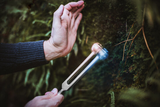 Hand Of Sound Healing Therapist Holding Healing Frequency Vibrating Tuning Fork