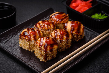 Delicious warm sushi roll with tuna, salmon, shrimp, cucumber and cream cheese