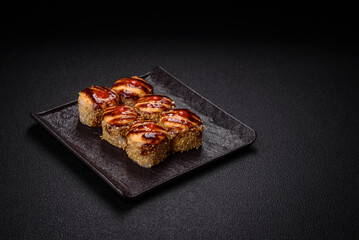 Delicious warm sushi roll with tuna, salmon, shrimp, cucumber and cream cheese