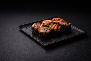 Delicious warm sushi roll with tuna, salmon, shrimp, cucumber and cream cheese