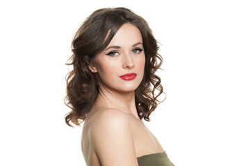 Naklejka premium Isolated woman brunette with makeup and shiny wavy brown hair studio portrait. Fashion, make-up, hairstyle, personal care, beauty salon, cosmetics and fashion concept
