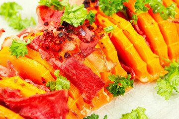 Baked pumpkin with bacon, macro.